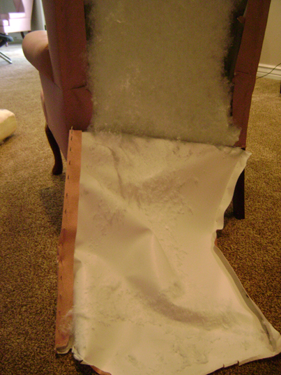 back of pink chair torn open