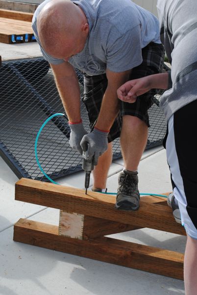 Trellis Justin putting in lag bolts