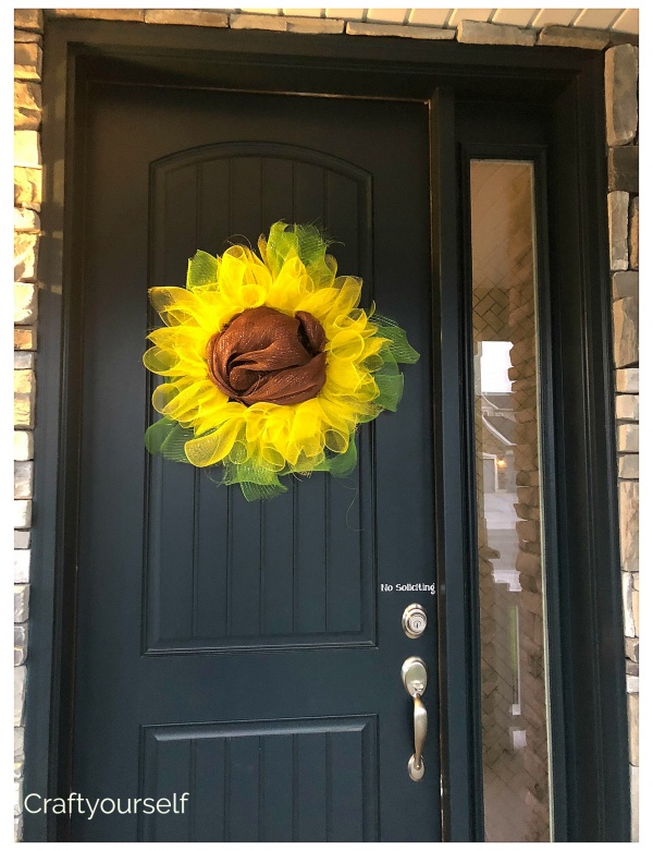 Sunflower deco mesh wreath on navy blue door